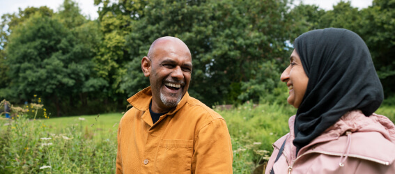 two people hiking in grassy field